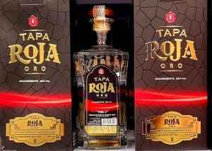 Presentación de la Botella de Tapa Roja Oro